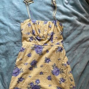 forever 21 yellow tight fitting mini dress with purple flowers and a ruffled top